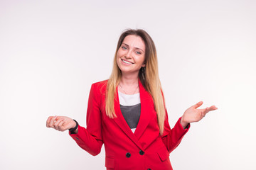 Laughing blond hair young woman in a red jacket with opened pose.