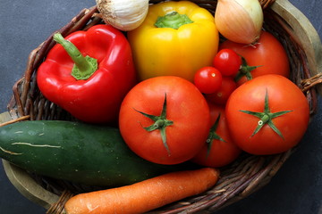 Variety of fresh vegetables in market basket, top view
