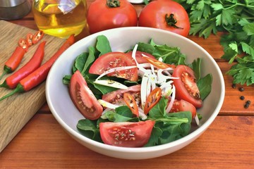 Fresh salad with tomatoes and onion, rustic style.