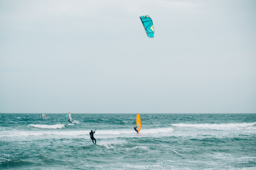 Kitesurfer and windsurfers