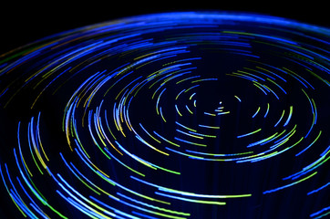 purple and blue vortex effect created with fiber optic light source