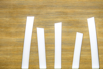 Empty wooden bar countertop with cafe-restaurant blur in dark night background selective focus. Wood texture.