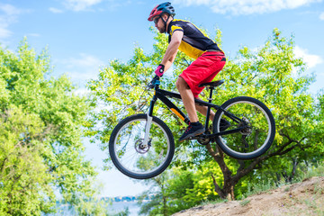 The concept of extreme cycling, a mountain bike jump.