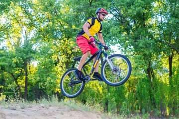 Naklejka premium The concept of extreme cycling, a mountain bike jump.