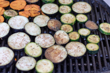 Top view on vegetable slices on the grillage for barbecue