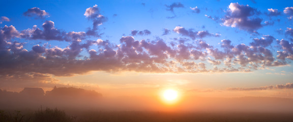 summer landscape with sunrise and fog