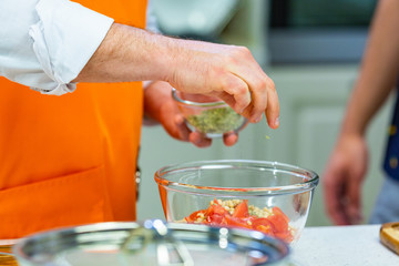 kitchen Preparation: the chef prepares a salad
