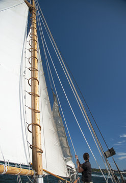 Hoisting Sails on Wooden Schooner Sailboat