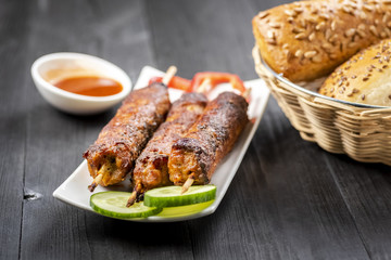 kebab on sticks served with vegetables