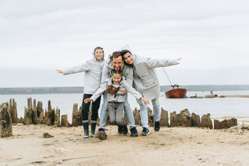 a young family have a fun near the sea on a boat background