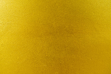 Fototapeta premium Shiny yellow leaf gold foil texture background