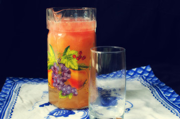 Still life. Orange lemonade on black background.