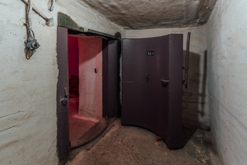 Large hermetic metal armored door, entrance of soviet military bunker 