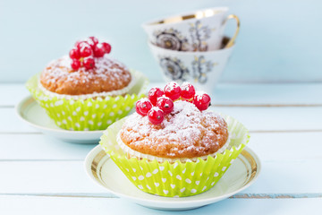 A festive dessert with red berries and powdered sugar. Cake with berries. Close-up. Copy space.