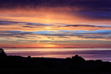 Summer sunset over Tralee Bay and the Maharees viewed from Camp on the Dingle Peninsula in County Kerry, Ireland
