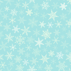 Christmas seamless pattern of snowflakes, white on light blue background.