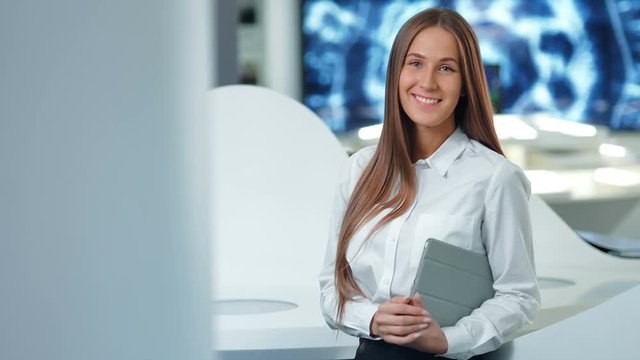 Portrait of attractive happy businesswoman in the modern office or lab. Future technologies concept