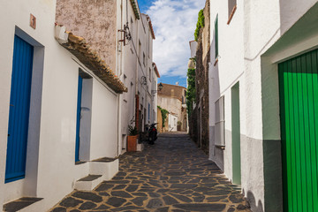 Street in Cadaques, Catalonia, Spain near of Barcelona. Scenic old town with nice beach and clear...