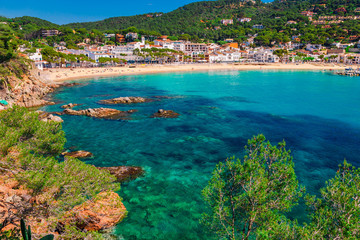 Sea landscape Llafranc near Calella de Palafrugell, Catalonia, Barcelona, Spain. Scenic old town with nice sand beach and clear blue water in bay. Famous tourist destination in Costa Brava
