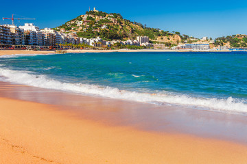 Sea landscape in Blanes, Catalonia, Spain near of Barcelona. Scenic town with nice sand beach and clear blue water in beautiful bay. Famous tourist resort destination in Costa Brava