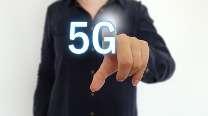 Businesswoman pointing finger on 5G