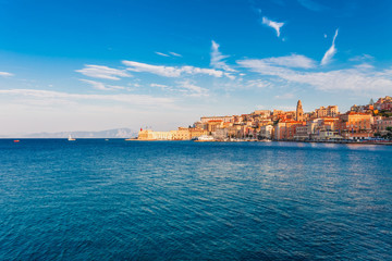 Fototapeta premium Panoramic sea landscape with Gaeta, Lazio, Italy. Scenic historical town with old buildings, ancient churches, nice sand beach and clear blue water. Famous tourist destination in Riviera de Ulisse