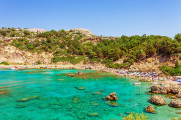 Obraz premium Sea skyview landscape photo Anthony Quinn bay near Ladiko bay on Rhodes island, Dodecanese, Greece. Panorama with nice sand beach and clear blue water. Famous tourist destination in South Europe
