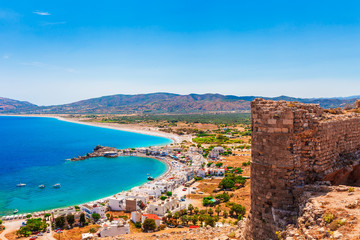 Sea skyview landscape photo from Feraklos castle near Agia Agathi beach on Rhodes island, Dodecanese, Greece. Panorama with sand beach and clear blue water. Famous tourist destination in South Europe - obrazy, fototapety, plakaty