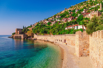 Landscape of ancient shipyard near of Kizil Kule tower in Alanya peninsula, Antalya district, Turkey, Asia. Famous tourist destination with high mountains. Part of ancient old Castle.