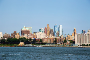 Fototapeta na wymiar New York City / USA - JUL 14 2018: Brooklyn downtown skyline view from Governors Island ferry on a clear afternoon
