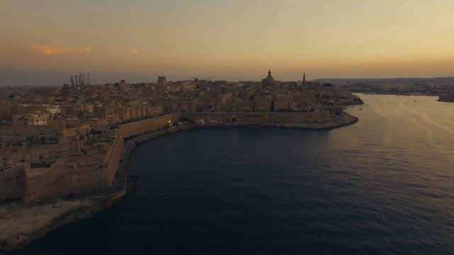 High aerial shot flying towards the Dome of Carmelite Church Valletta