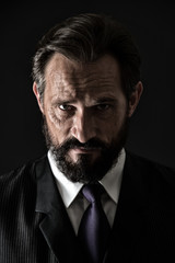 Bearded business man with serious look. Bearded business man with beard and mustache. Bearded business man with unshaven face. Bearded and stylish, vintage filter. Agile business.