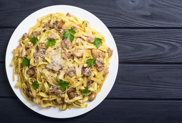 Pasta tagliatelle with chicken meat and mushroom