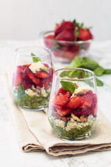 Spinach salad in glass.