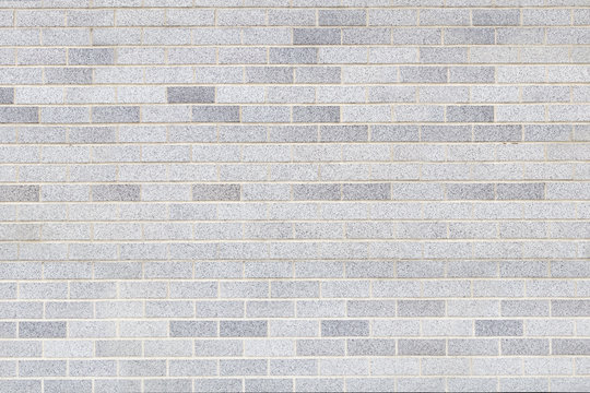 light colored brick wall white grey brick cement textured surface pattern