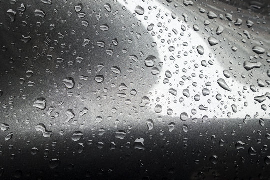 rain drops on painted metal surface