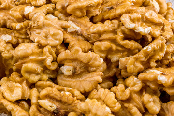 shelled walnuts on a wooden background