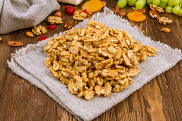 shelled walnuts on a wooden background