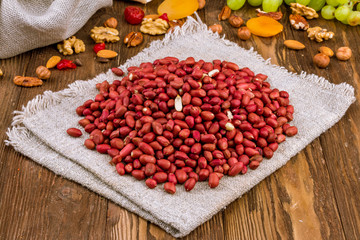 Roasted peanuts on wooden background