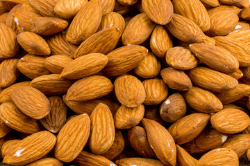 Almonds on wooden background