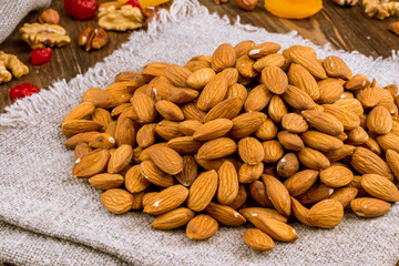 Almonds on wooden background