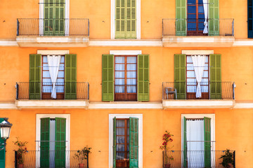 Fototapeta premium Doors and balconies on urban apartment building, Florence, Italy