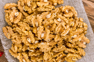 shelled walnuts on a wooden background