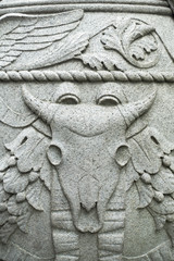 bas relief of bulls head and decorative elements