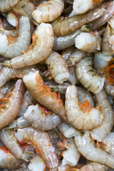 Raw fresh caught shrimp at the fish market on ice