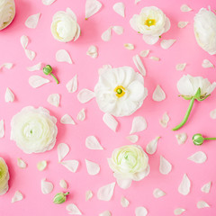 Flowers and petals on pink background. Flat lay, top view. Floral pattern