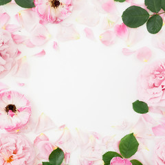Frame composition of pink rose flowers on white background. Flat lay, Top view. Flowers texture.