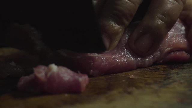Pork getting slice with a slowly smooth rotation