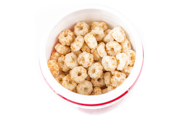 Piles of pale whole grain children's puffed cereal snack