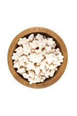 Piles of pale whole grain children's puffed cereal snack